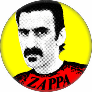 1 1/2” round pinback button of black and white Ben Day dot style portrait of Frank Zappa on a yellow background with red shirt reading “ZAPPA”