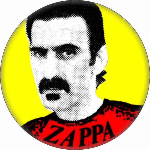 1 1/2” round pinback button of black and white Ben Day dot style portrait of Frank Zappa on a yellow background with red shirt reading “ZAPPA”