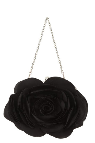 Purse made of a shiny satiny black fabric with layers of petal shapes sewn onto the body of the bag to resemble a rose. Silver metal hardware with a kiss lock and silver metal link chain strap. 