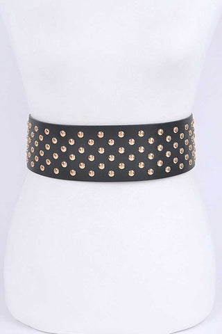 A black faux leather waist belt covered with gold metal round studs. Shown from front on dress form