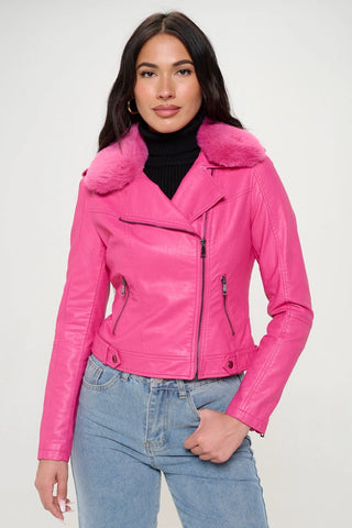 A model wearing a hot pink faux leather motorcycle style jacket with a matching hot pink faux fur collar. The jacket has silver metal zippers and hardware. Shown from the front zipped up
