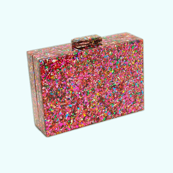 Rectangular hard resin clutch purse with chunky rainbow confetti inlaid. Large silver and gold glitter lightning bolt on front. Shown from the back