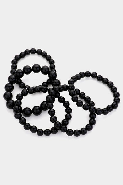black shiny beaded stretch bracelets shown scattered