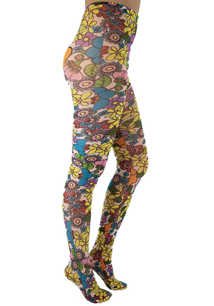 A model wearing tights printed with an all-over pattern of retro illustrations of multicolored yellow, purple, blue, green, red, and pink flowers with black outlines on a pale blush pink background. Shown from the side 
