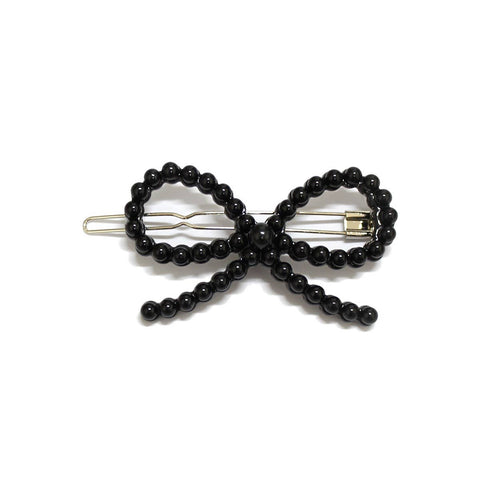 Symmetrical bow shaped barrette with black round bead decoration 
