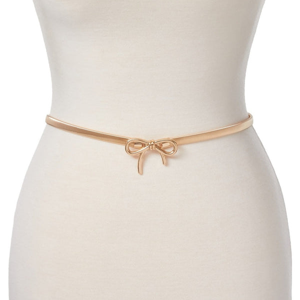 Dress form wearing a gold metal serpentine style stretch belt with a matching metal bow buckle