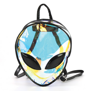 Iridescent semi transparent vinyl mini backpack in the shape of an alien head with large black vinyl eyes and black adjustable straps and handle. Shown from the front