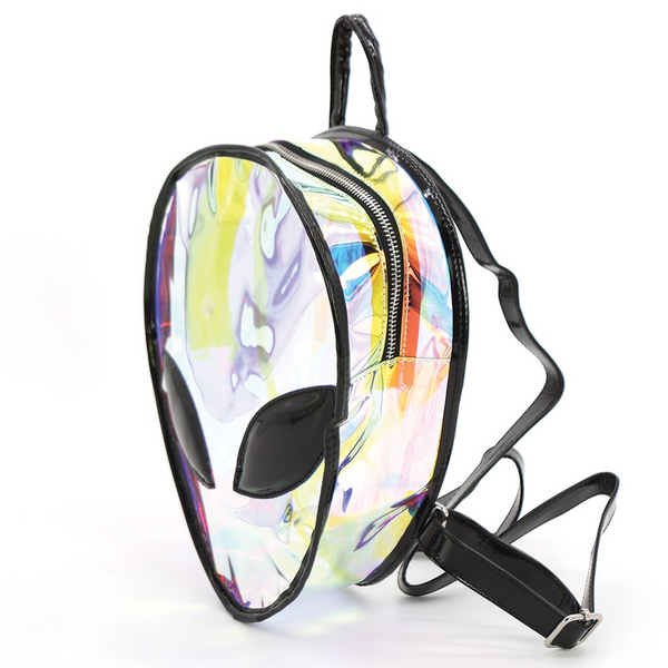 Iridescent semi transparent vinyl mini backpack in the shape of an alien head with large black vinyl eyes and black adjustable straps and handle. Shown from a three quarter angle