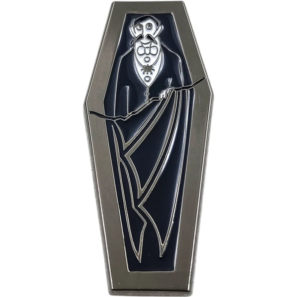 black enameled silver metal pin of Edward Gorey's depiction of Dracula in his coffin