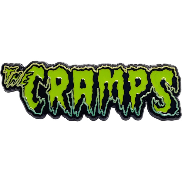 The Cramps logo enamel pin featuring the band's name in dripping neon green lettering with a black and white outline on a white background.