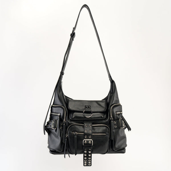 black textured faux leather crossbody bag with 8 exterior pockets with silver metal zip closure and cone stud & o-ring detail on oversized strap detail. Bag has 27" adjustable self strap. Shown from front