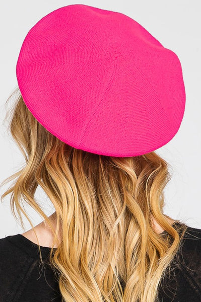 French style acrylic beret in neon pink, shown on model