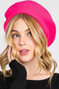 French style acrylic beret in neon pink, shown on model