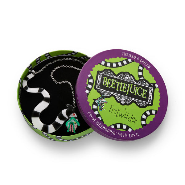 Black and white striped Beetlejuice Sandworm pendant on a silver metal chain, shown in illustrated round box packaging