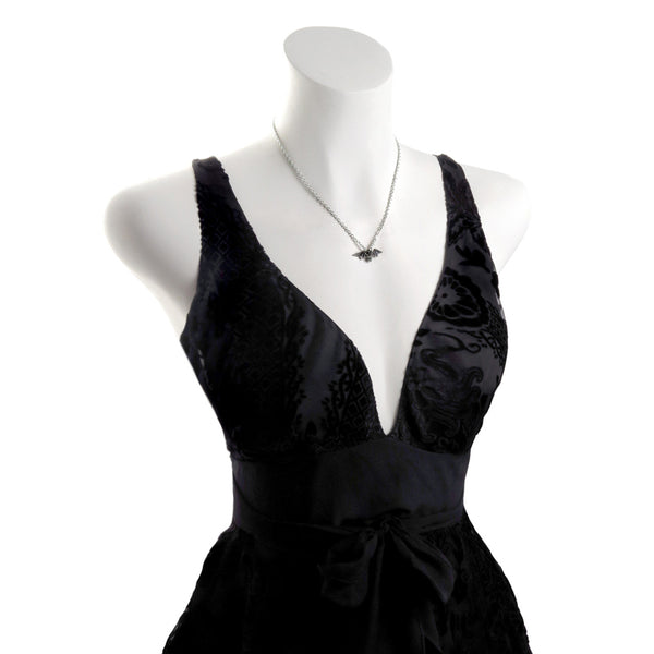 Antiqued Fine English Pewter pendant of bat with outstretched wings on a linked chain. Shown on dress form