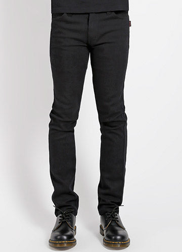 guy's sizing five pocket black stretch denim jeans, shown waist down on a model