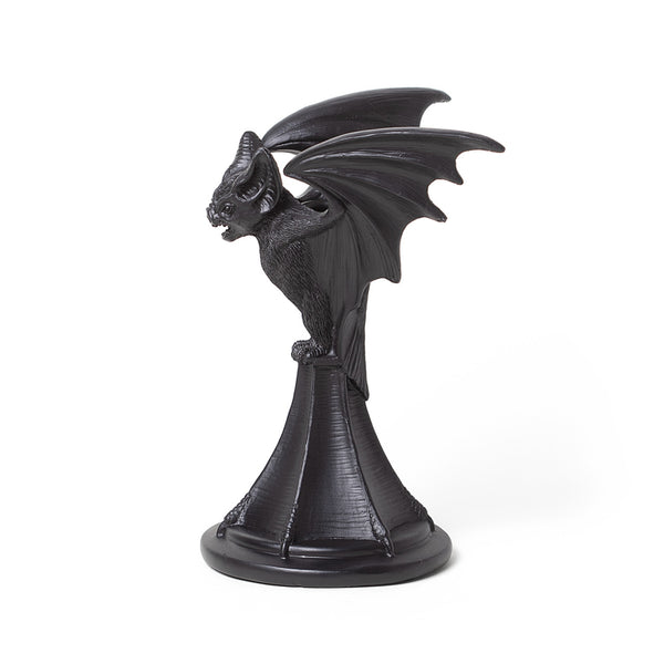 Black resin taper style candleholder in the shape of a highly detailed vampire bat with open mouth and outstretched wings. Shown from the side
