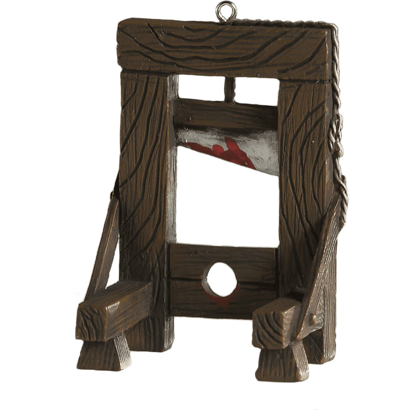 resin handpainted ornament in the shape of a wooden guillotine with a bloody blade