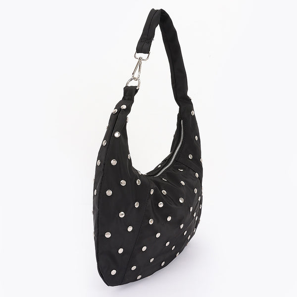 black nylon slouchy shoulder bag with silver flat round stud detail, zip closure, and asymmetrical metal clasp detail at shoulder strap. Shown from front