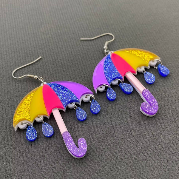 yellow, neon pink, blue, and purple multicolored sparkly umbrella dangle earrings with attached sparkly blue raindrop charms