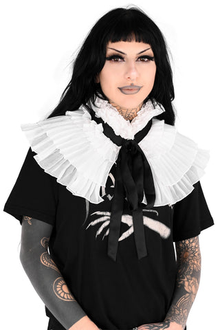 Person wearing a white chiffon ruffled collar with 4 rows of ruffles and high neck with long black satin ribbon tie