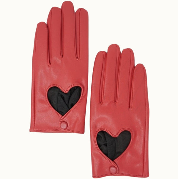 A pair of cherry red faux leather wrist-length gloves with a heart-shaped cutout on the back of the hand and single snap closure. Shown flat