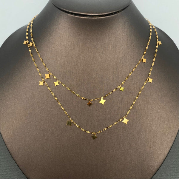 double layer 18k gold plated stainless steel lip chain necklace with stylized star charms. Shown on dress form