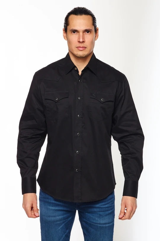 Model wearing a black cotton twill western style button up shirt with black pearl snap closures. Shown from the front