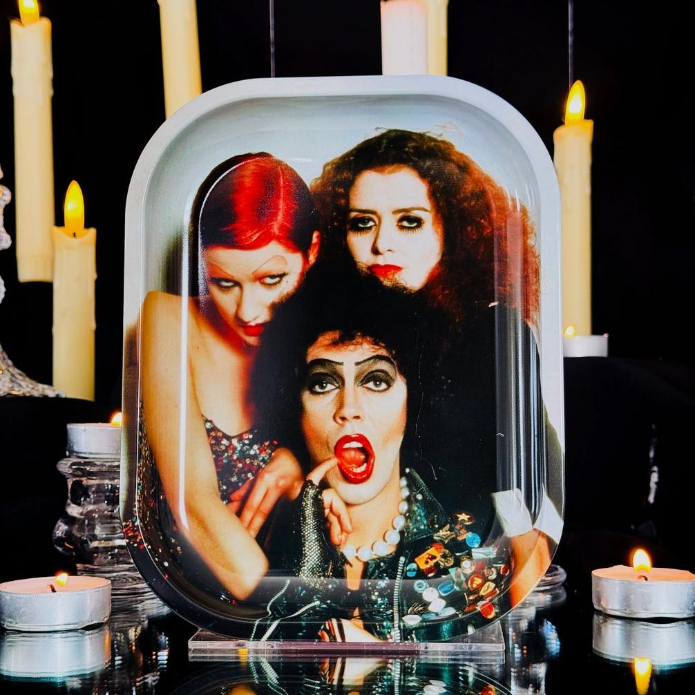 rectangular tin tray with rounded edges and shiny full color image of Columbia, Dr. Frank N. Furter, and Magenta from the Rocky Horror Picture Show. Shown upright