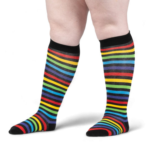 unisex wide calf fit black and rainbow stripe knee socks. Shown worn from the side