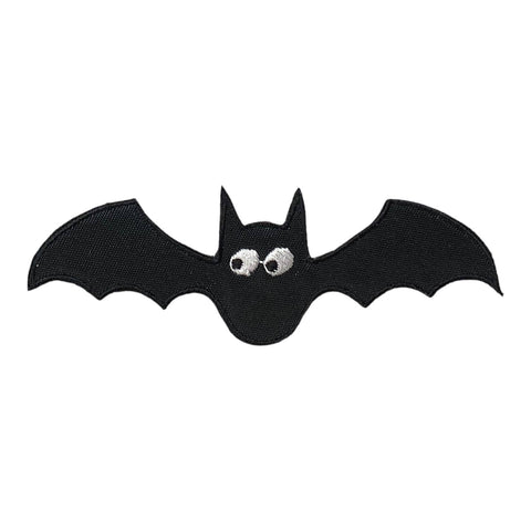 Black bat-shaped patch with large black and white eyes on a white background