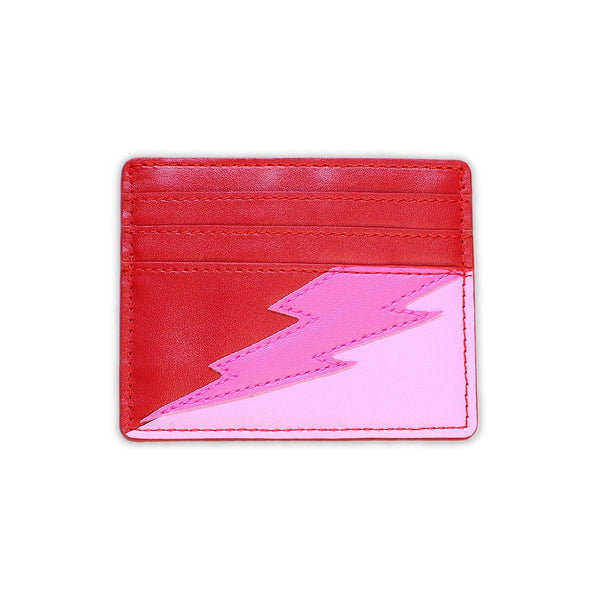 rectangular faux leather 6 slot card holder in bright red and bubblegum pink with diagonal hot pink faux leather lightning bolt applique in middle. Shown from front