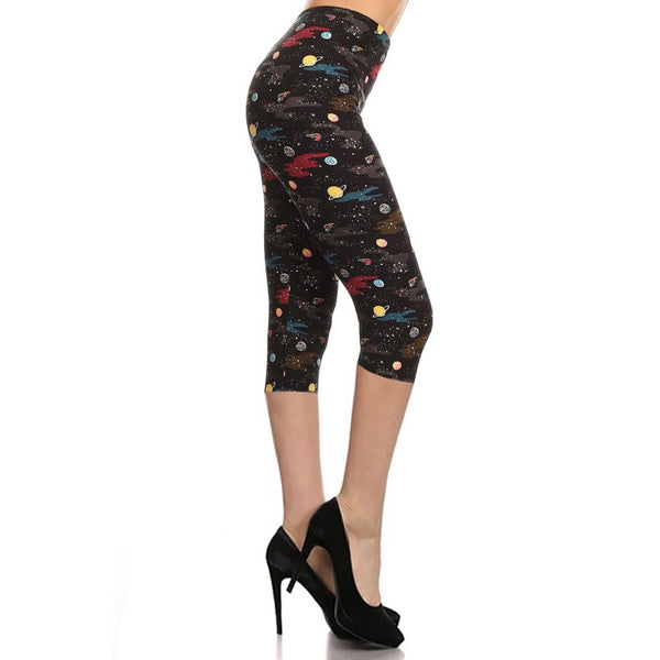 black background outer space print with planets, stars, and comets stretch knit high-waist capri length leggings, shown side view on model