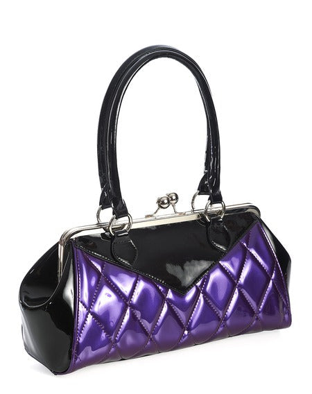 Vintage-inspired handbag made of black and red vinyl with purple pearly quilted body and black sides & top with matching black handles. Purse has silver metal kiss lock opening and matching detachable shoulder strap. Shown from side