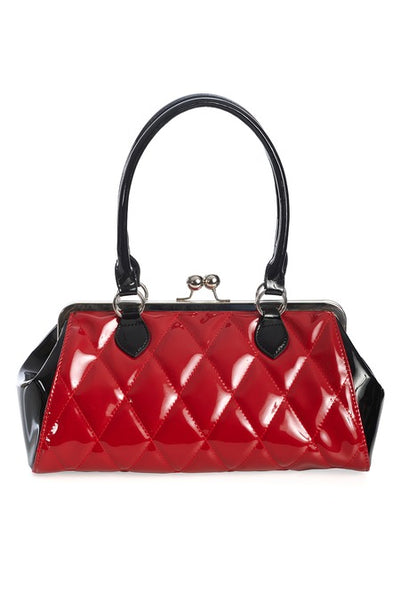 Vintage-inspired handbag made of black and red vinyl with red quilted body and black sides & top with matching black handles. Purse has silver metal kiss lock opening and matching detachable shoulder strap. Shown from back