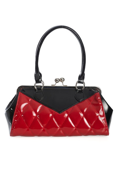 Vintage-inspired handbag made of black and red vinyl with red quilted body and black sides & top with matching black handles. Purse has silver metal kiss lock opening and matching detachable shoulder strap. Shown from front
