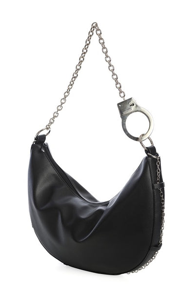 Black faux leather crescent shaped slouchy shoulder bag with silver metal handcuff chain strap and matching silver chain running across the bottom of the bag. Shown from side