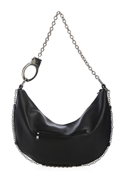Black faux leather crescent shaped slouchy shoulder bag with silver metal handcuff chain strap and matching silver chain running across the bottom of the bag. Shown from back to display exterior zip pocket