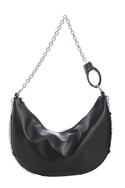 Black faux leather crescent shaped slouchy shoulder bag with silver metal handcuff chain strap and matching silver chain running across the bottom of the bag. Shown from front