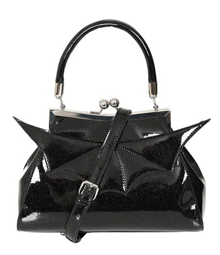 A black patent vinyl with shimmery silver handbag with a glossy finish, featuring a bat-wing design on the front, a top handle, and a silver-tone kiss-lock clasp. Shown from front with crossbody strap 