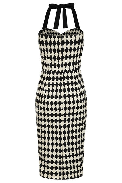 Halter style wiggle dress in black and white harlequin printed cotton sateen with sweetheart neckline, contrasting black black trim at the bodice with black halter straps and princess seaming with pencil length skirt. Shown from back