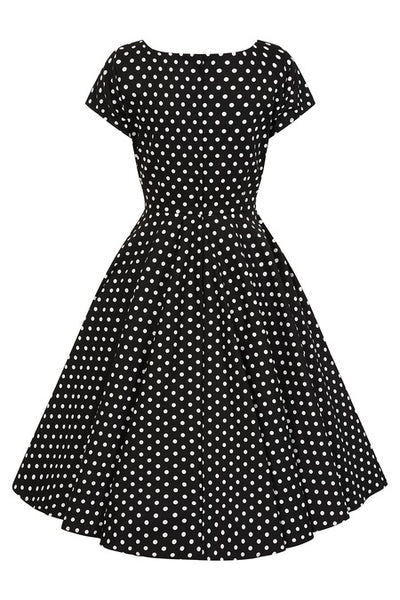 back view of a black dress with white polka dots on a white background