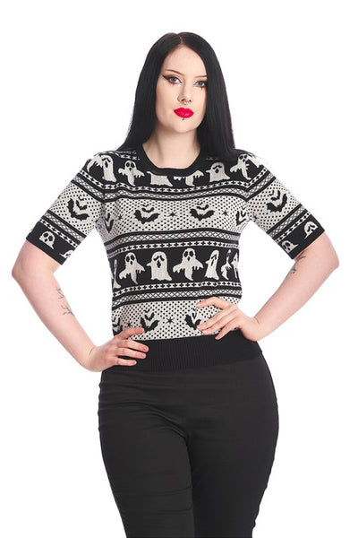 model wearing cotton pullover short sleeve sweater with round ribbed neckline and black & white knit-in Fair Isle style horizontal pattern of ghosts and bats. Shown from front