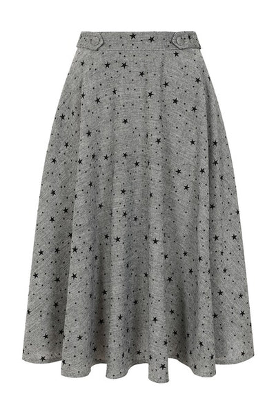 grey tweed high waisted swing skirt with all over flocked black star pattern, fabric covered button detail at waistband, and pockets. Shown from front