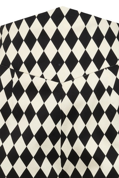 Black and white harlequin patterned stretch cotton sateen cigarette style pants with a high yoke style waistband. Shown from front on mannequin in close up of waistband