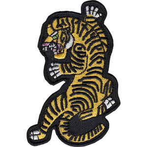 Embroidered patch of a tiger snarling in classic tattoo illustration style