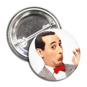 1” round pinback button of Pee Wee Herman in his classic suit and red bow tie making a face on a white background 