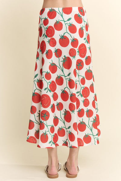 model wearing silk weave midi skirt with elastic waistband and off-white background sketch style red and green tomato pattern. Shown from back in close up