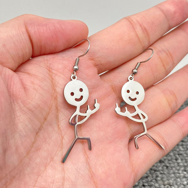 stainless steel dangle earrings with charms in the shape of stick figures with smiley faces flipping the bird in mirror image