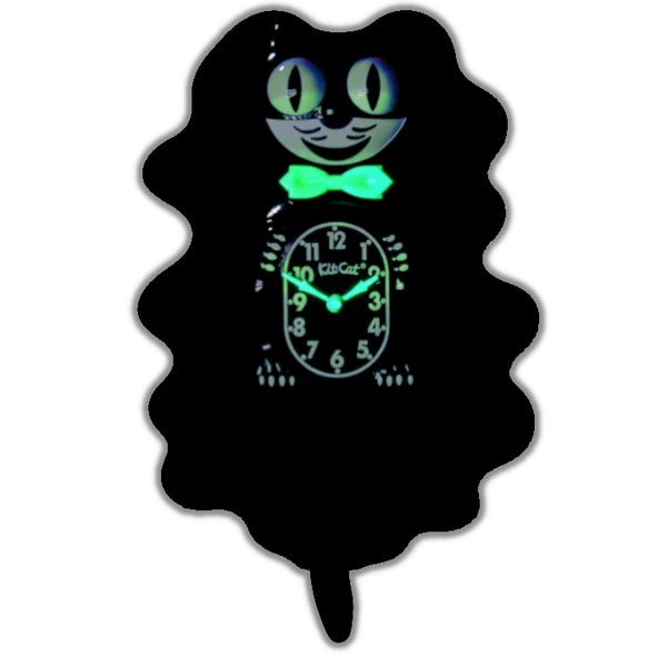 black & white glow in the dark Kit-Cat wall mount clock features a mischievous grin, and big round eyes that swivel side-to-side in time with its pendulum tail. Shown in dark with glowing bowtie and clock hands